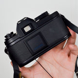 Nikon EM 35mm Film Camera with Nikon Series E 50mm 1:1.8 Lens