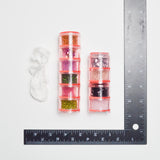 Assorted Beads in Pink Screw-Top Containers