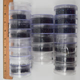 Assorted White, Black + Dark Iridescent Blue Beads in Organizing Containers
