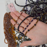 Assorted Black + Brown Strings of Beads