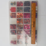 Assorted Pink, Purple + Red Beads in Organizing Case