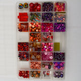 Assorted Pink, Purple + Red Beads in Organizing Case