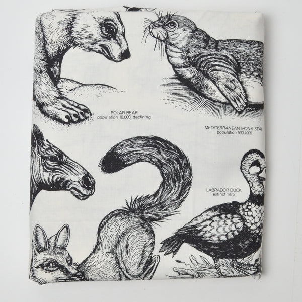 Extinct + Endangered Animal Print Stain Repellant-Coated Woven Fabric - 50" x 96"