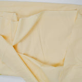 Pastel Yellow Quilting Weight Woven Fabric with Cross Stitch Print Border on Bottom - 66" x 102"