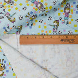 Light Blue, Green, Pink + White Soccer Player Print Flannel Woven Fabric - 40" x 45"