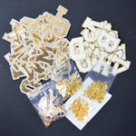 Assorted Gold Letter Appliqués and Charms