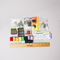 Assorted Thread, Bobbins + Sewing Machine Feet