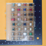 Metal Bobbins with Colorful Thread in Organizing Case